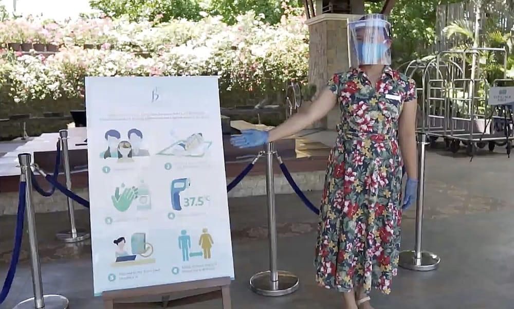 The Bellevue Resort Đảo Đảo Panglao Ngoại thất bức ảnh A woman wearing a face shield at the entrance of a hotel in Paris, France